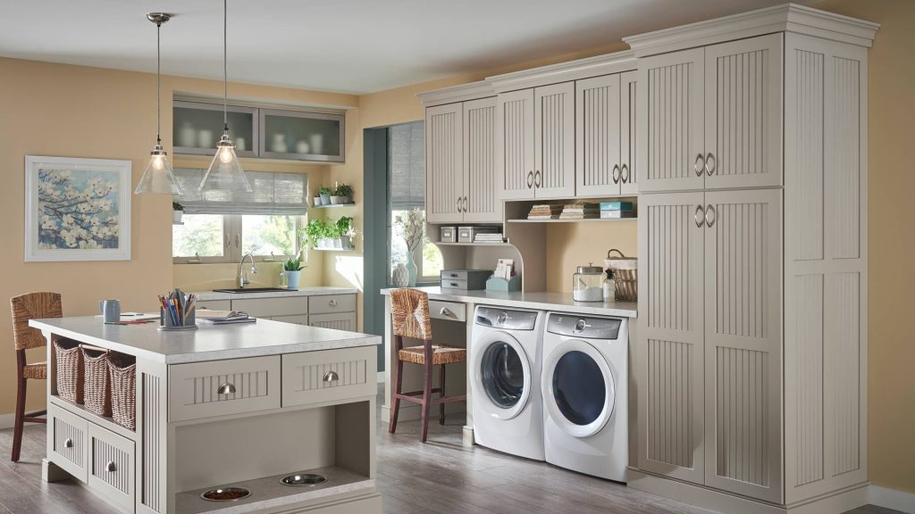 https://thecocoon.com/wp-content/uploads/2019/10/schuler-cabinetry-hint-color-laundry-room-remodel-design-build-cocoon-1024x576.jpg